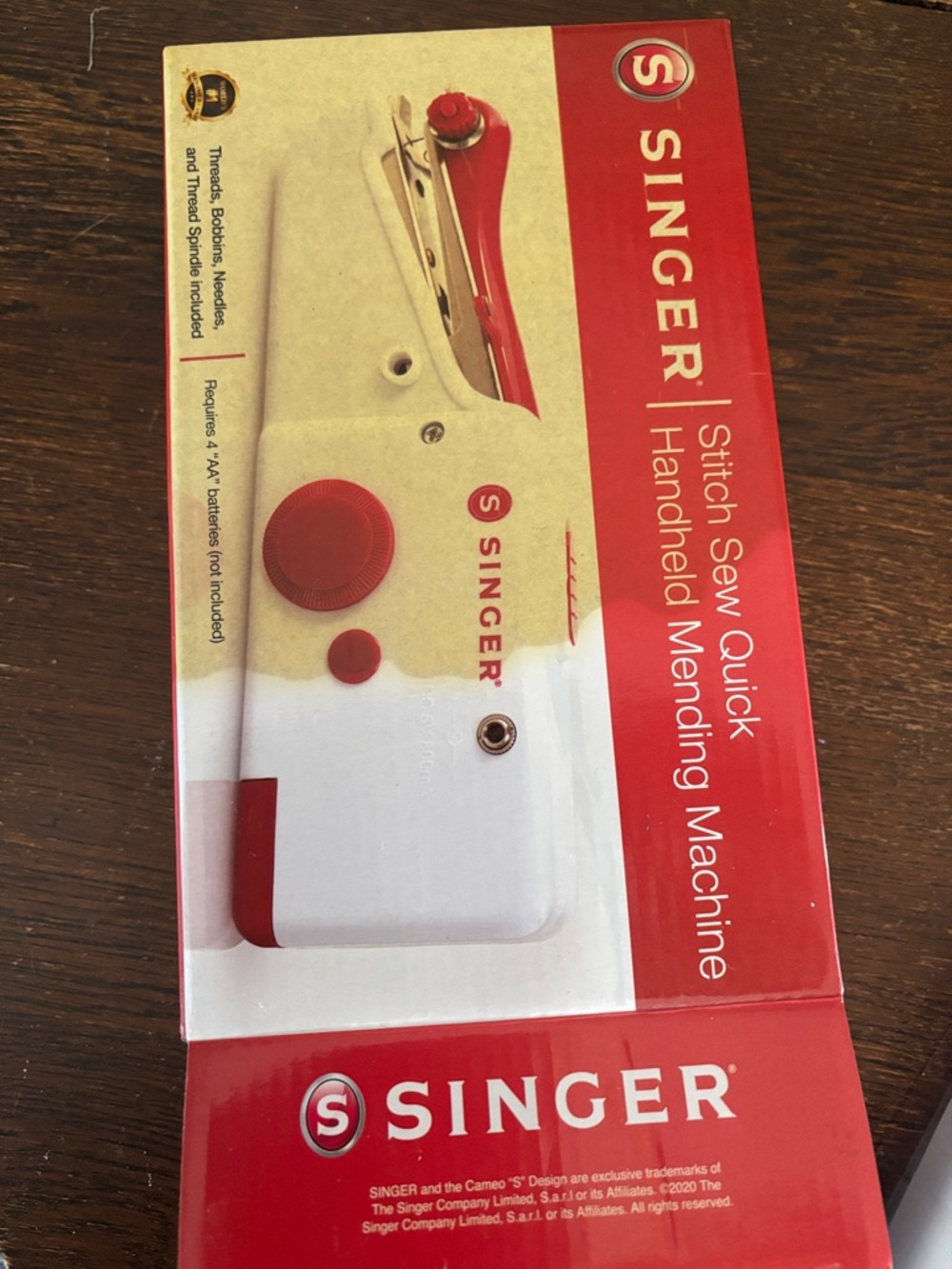 Handheld sewing machine